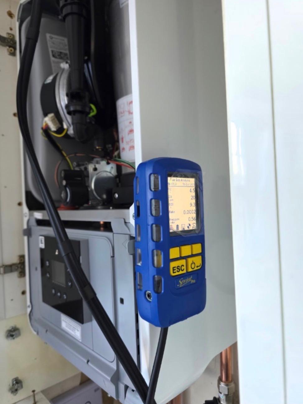 Flue gas analyser reading combustion figures on a serviced boiler