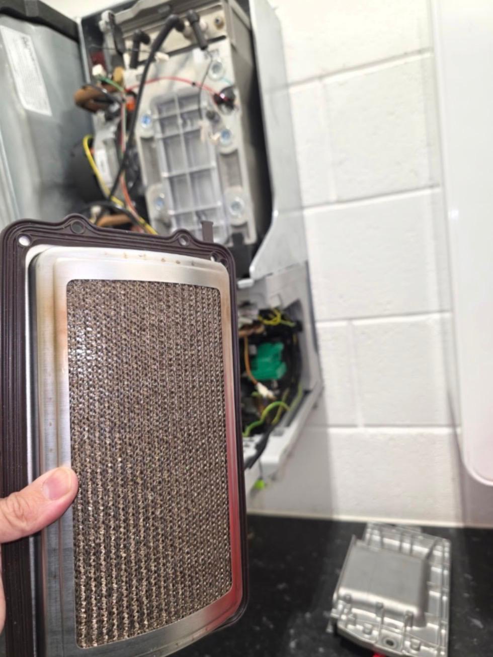 Sooted burner assembly removed from a boiler during a deep service